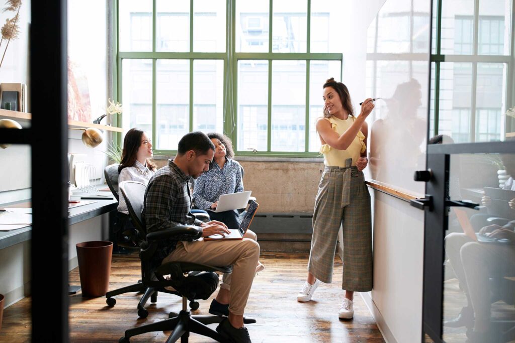 A diverse team collaborating in a modern office workspace